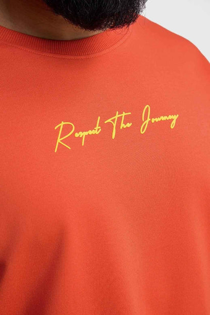 Orange oversized T-shirt from Fuaark Nz with "Respect The Journey" print, casual style, shown on a plain background.
