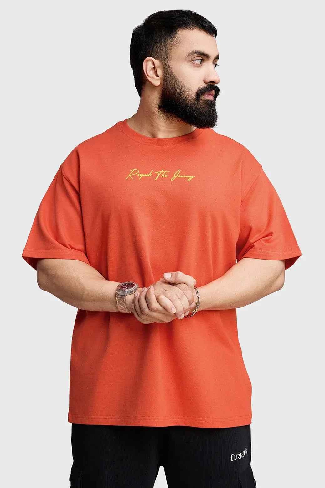 Orange oversized T-shirt from Fuaark Nz with "Respect The Journey" print, casual fit, and comfortable fabric.