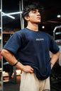 Navy oversized T-shirt from Fuaark Nz featuring a bold sword graphic on the front, casual and comfortable fit.
