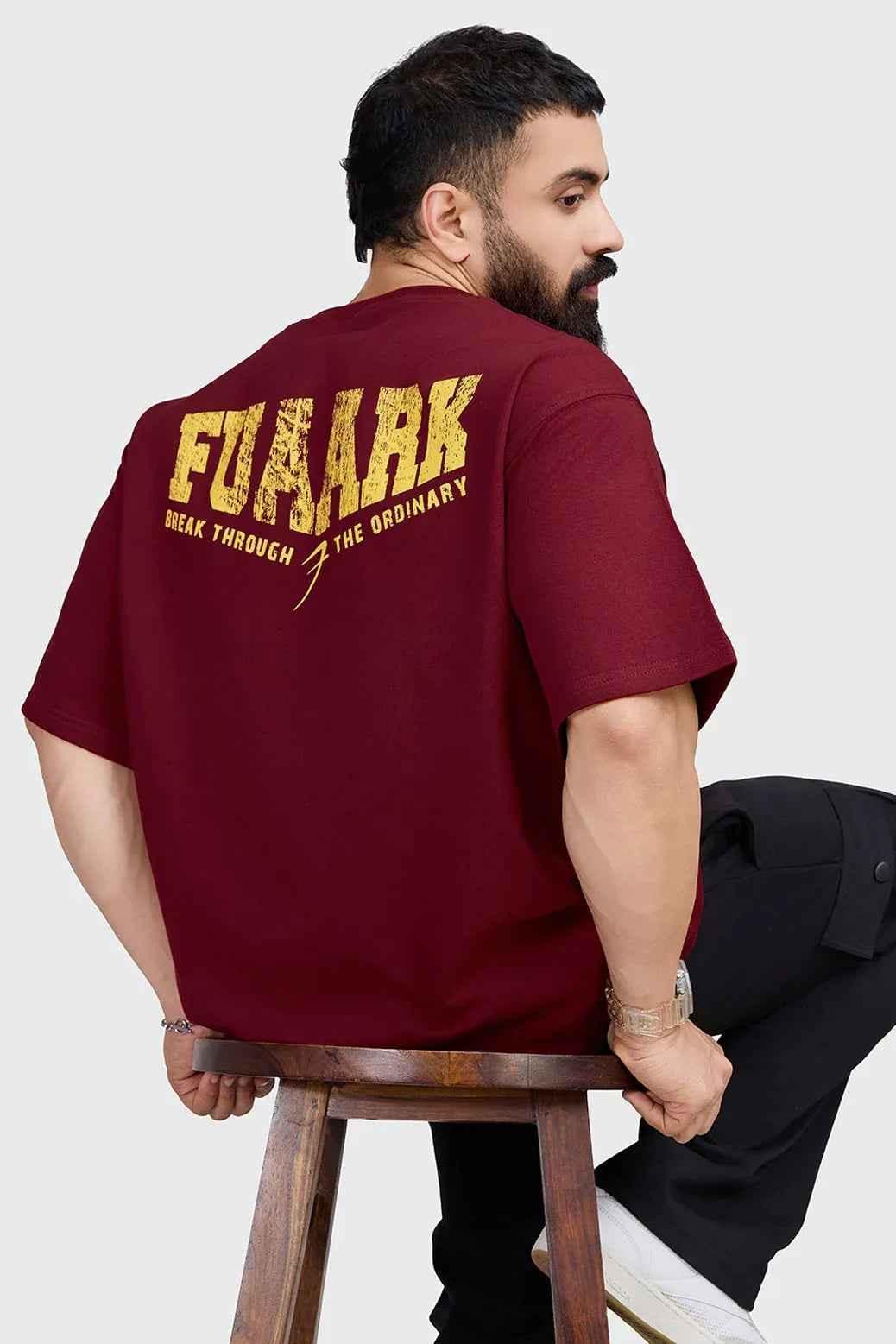 Fuaark Nz oversized maroon T-shirt with trendy fit, casual style, and soft fabric, shown on a hanger.