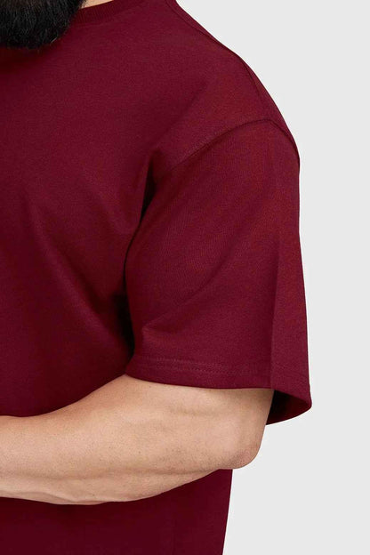Fuaark Nz Trendsetter oversized maroon T-shirt for women, featuring a relaxed fit and stylish design.