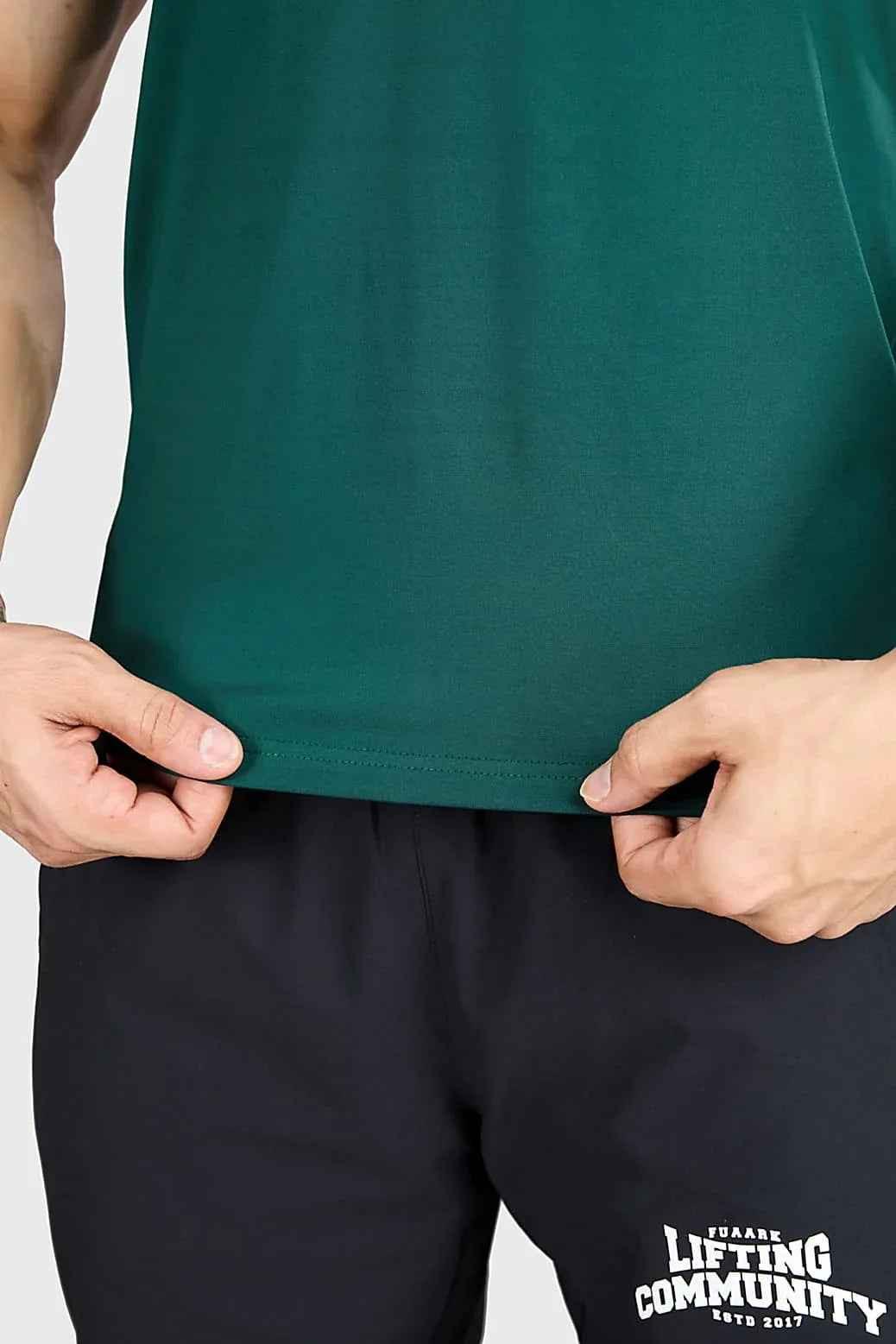 Fuaark NZ Urban T-shirt in emerald green, slim fit style, soft fabric, displayed on a hanger.