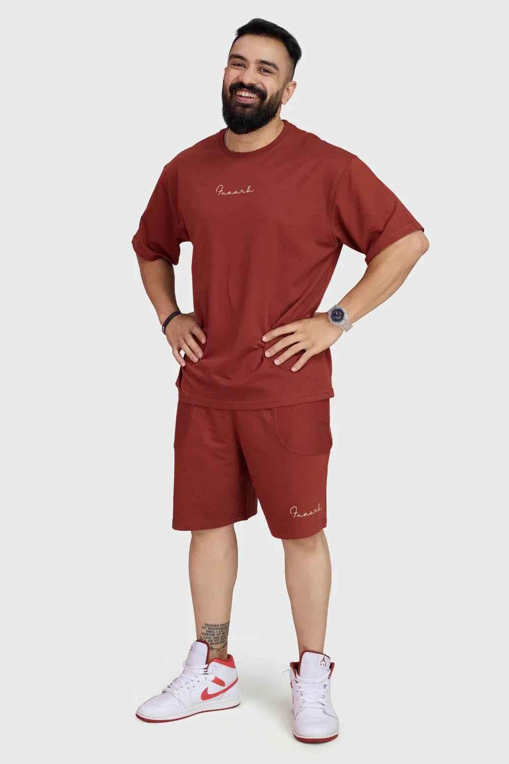 Fuaark Nz oversized rust T-shirt for women, casual fit, soft fabric, perfect for weekend comfort, displayed on a hanger.