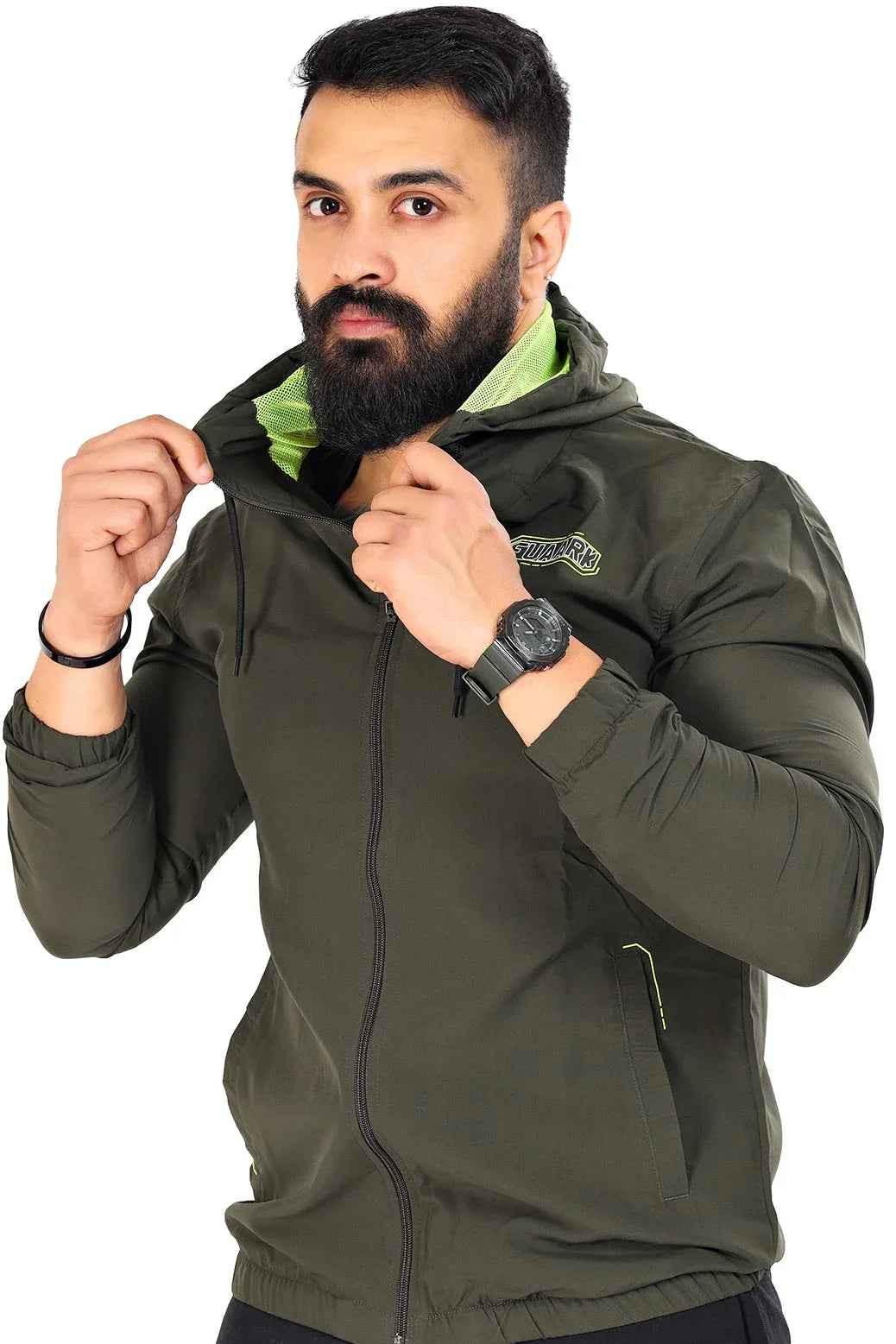 Fuaark NZ Velocity windbreaker jacket in olive color, lightweight and wind-resistant, shown on a hanger.