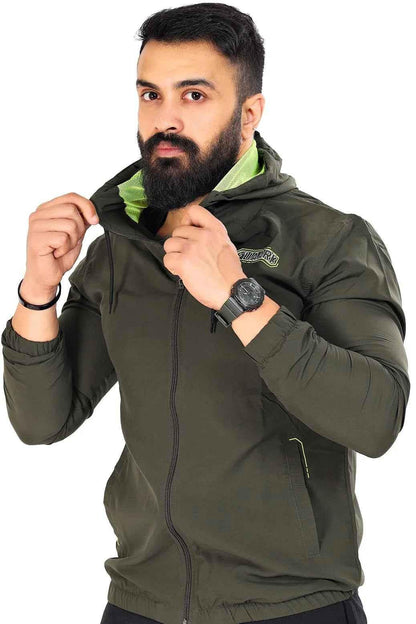 Fuaark NZ Velocity windbreaker jacket in olive color, lightweight and wind-resistant, shown on a hanger.
