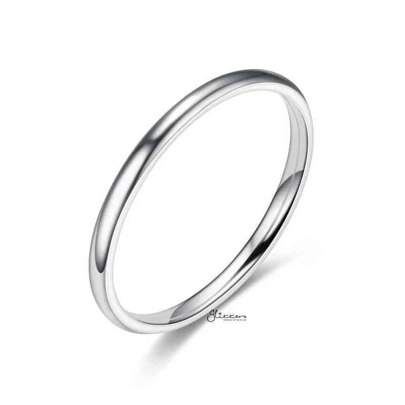 Stainless steel 2mm wide glossy mirror polished plain band ring by Glitters, showcasing its smooth, reflective surface and simple design.