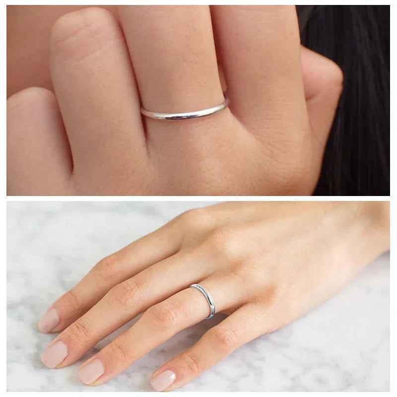 Stainless steel 2mm wide glossy mirror-polished plain band ring by Glitters, showcasing a smooth, reflective surface.