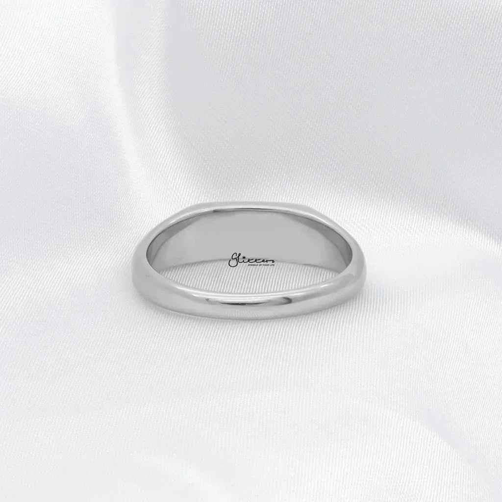 Silver stainless steel rectangle signet ring by Glitters, featuring a sleek rectangular design and polished finish.