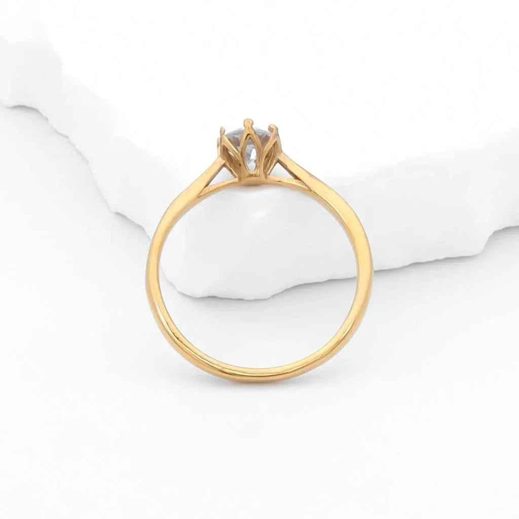 Gold stainless steel engagement ring with five cubic zirconia stones, stylish wedding band by Glitters.