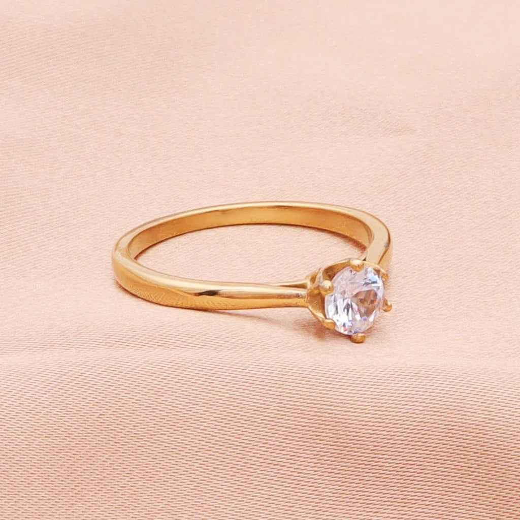 Gold stainless steel wedding engagement ring with five cubic zirconia stones, designed by Glitters.
