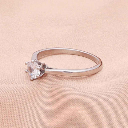 Silver stainless steel wedding engagement ring with five cubic zirconia stones, designed by Glitters.