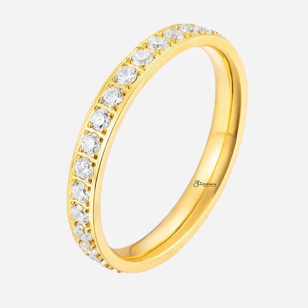 Gold stainless steel band ring with CZ inlay by Glitters, close-up of the fully inlayed design and polished finish.