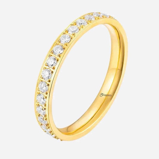 Gold stainless steel band ring with CZ inlay by Glitters, close-up of the fully inlayed design and polished finish.
