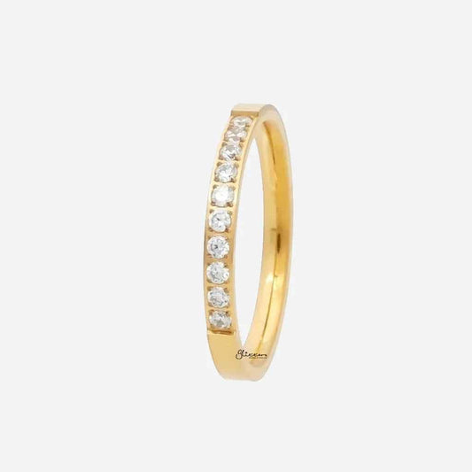 Gold stainless steel ring with 10 CZ inlay, showcasing a sleek band design by Glitters.