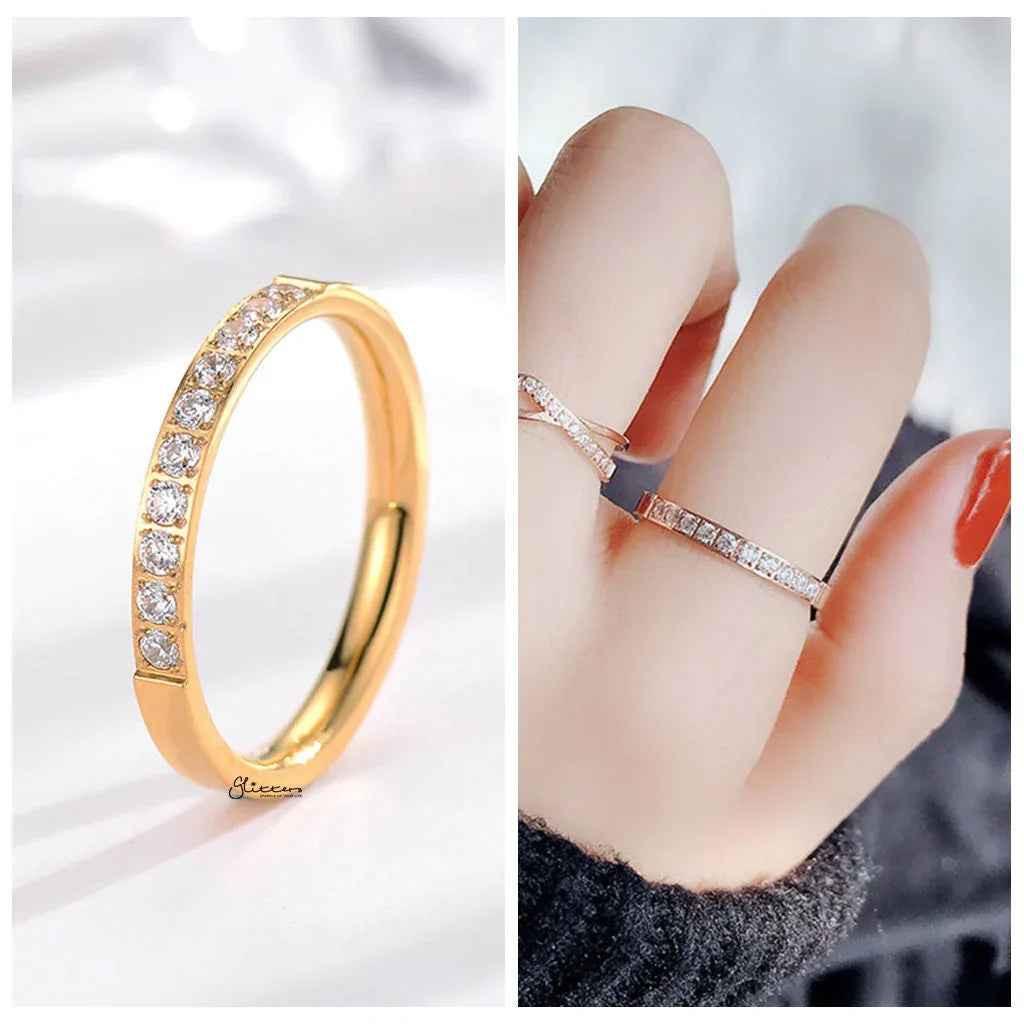 Gold stainless steel band ring with 10 cubic zirconia inlays, stylish and elegant jewelry by Glitters.