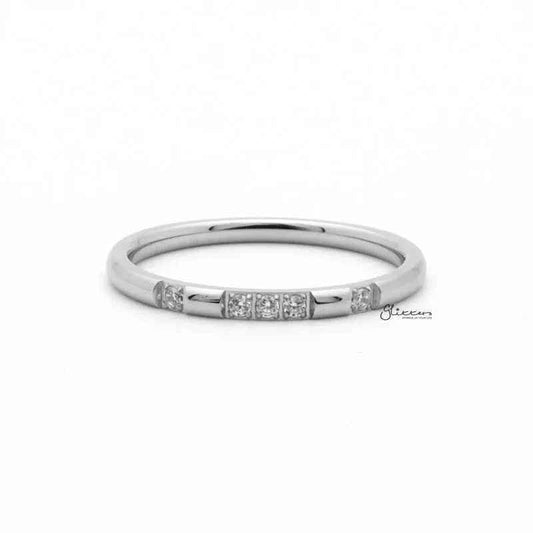 Silver stainless steel ring with five CZ inlay accents, stylish band from Glitters, showcasing a sleek, modern design.