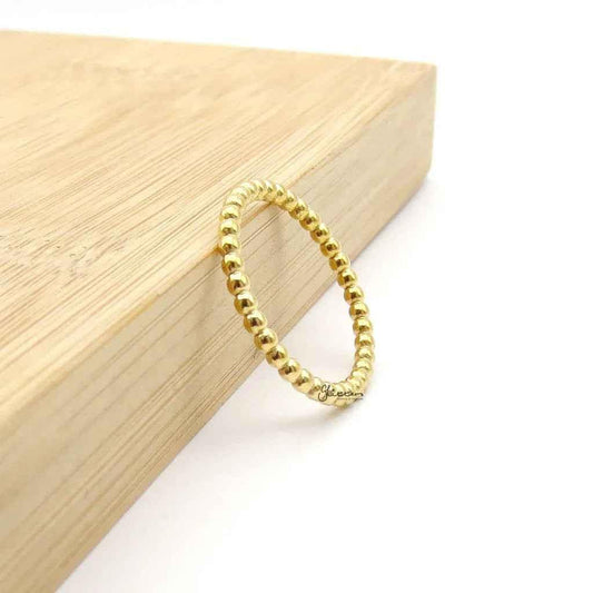 Gold stainless steel bead stacking ring by Glitters, featuring a smooth, rounded design perfect for layered jewelry styles.