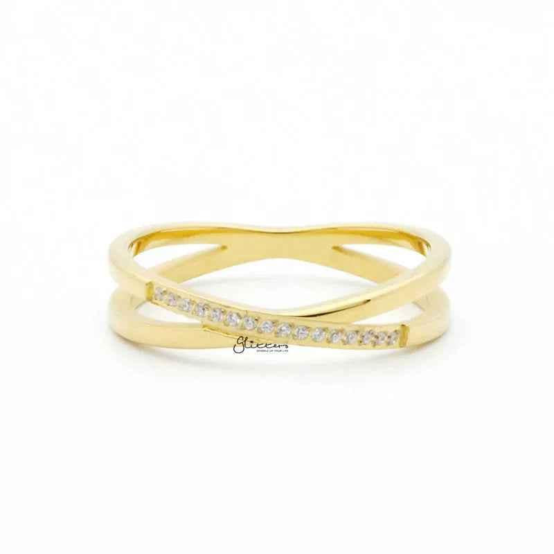 Gold stainless steel criss cross X ring by Glitters, showcasing a sleek, modern design with a polished finish.