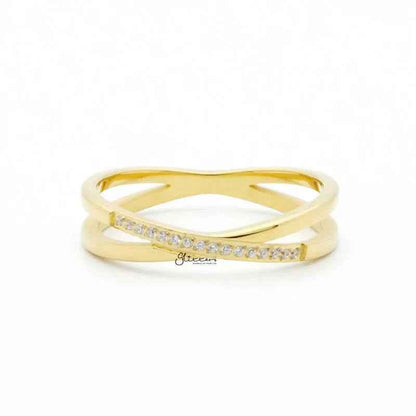 Gold stainless steel criss cross X ring by Glitters, showcasing a sleek, modern design with a polished finish.