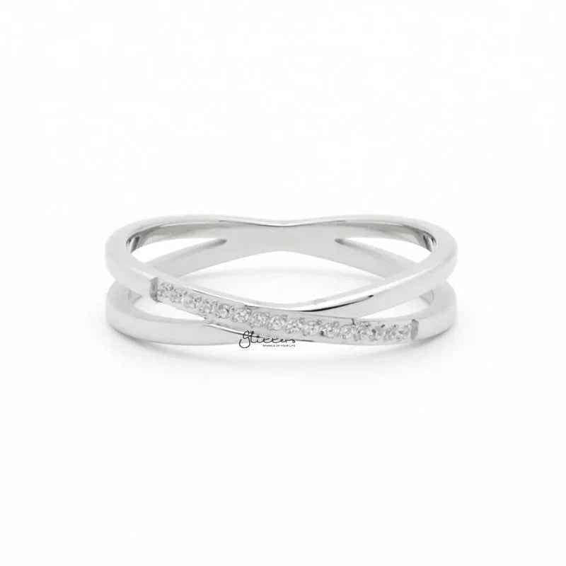 Silver stainless steel criss cross X ring by Glitters, showcasing a sleek, modern design with polished finish.