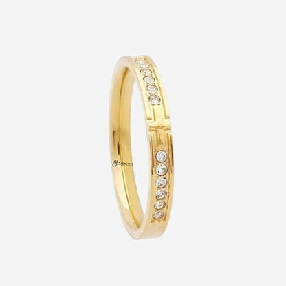 Gold stainless steel cross ring with sparkling cubic zirconia stones, designed by Glitters.
