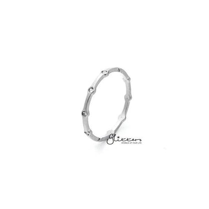 Stainless steel CZ dots women's ring by Glitters featuring a sleek band with sparkling cubic zirconia accents.