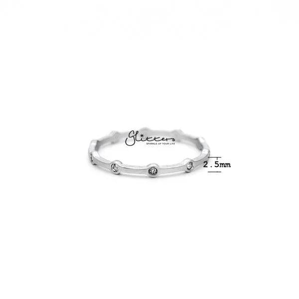 Stainless steel CZ dots women's ring by Glitters featuring a sleek band with sparkling cubic zirconia accents.