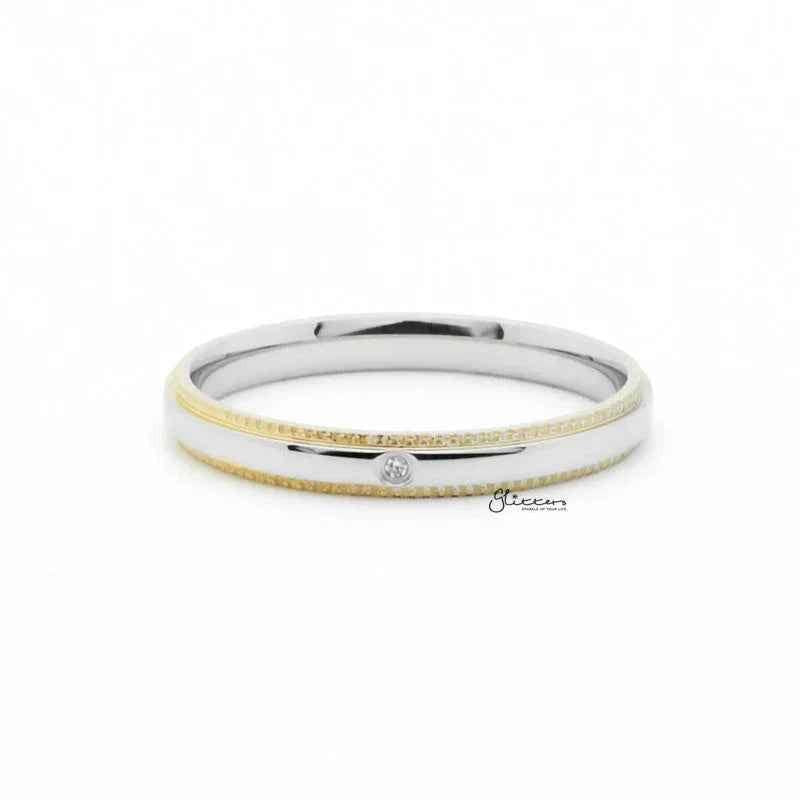 Gold stainless steel ring with CZ inlay, featuring a sleek band design from Glitters stainless steel rings collection.