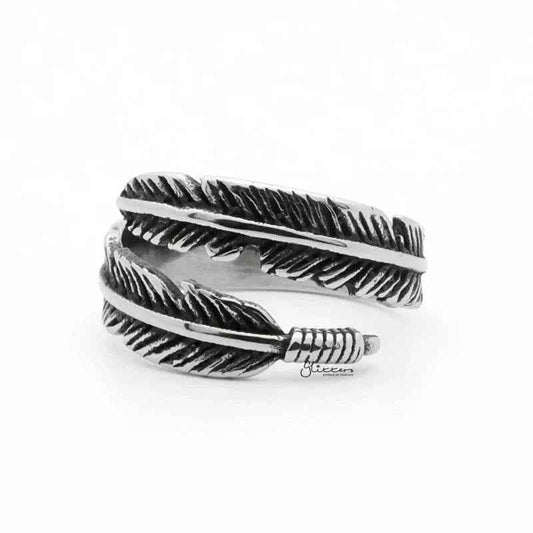 Silver stainless steel feather ring by Glitters, close-up of intricate feather design on a polished band.