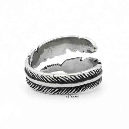 Silver stainless steel feather ring by Glitters, showcasing a detailed feather design on a sleek band.
