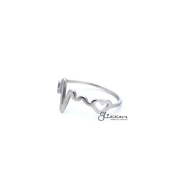 Stainless steel heartbeat and heart women's rings by Glitters, featuring detailed heartbeat and heart designs on sleek band jewelry.
