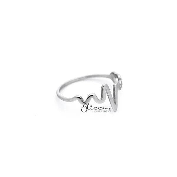 Stainless steel heartbeat and heart women's rings by Glitters, featuring sleek silver designs with heartbeat and heart motifs.