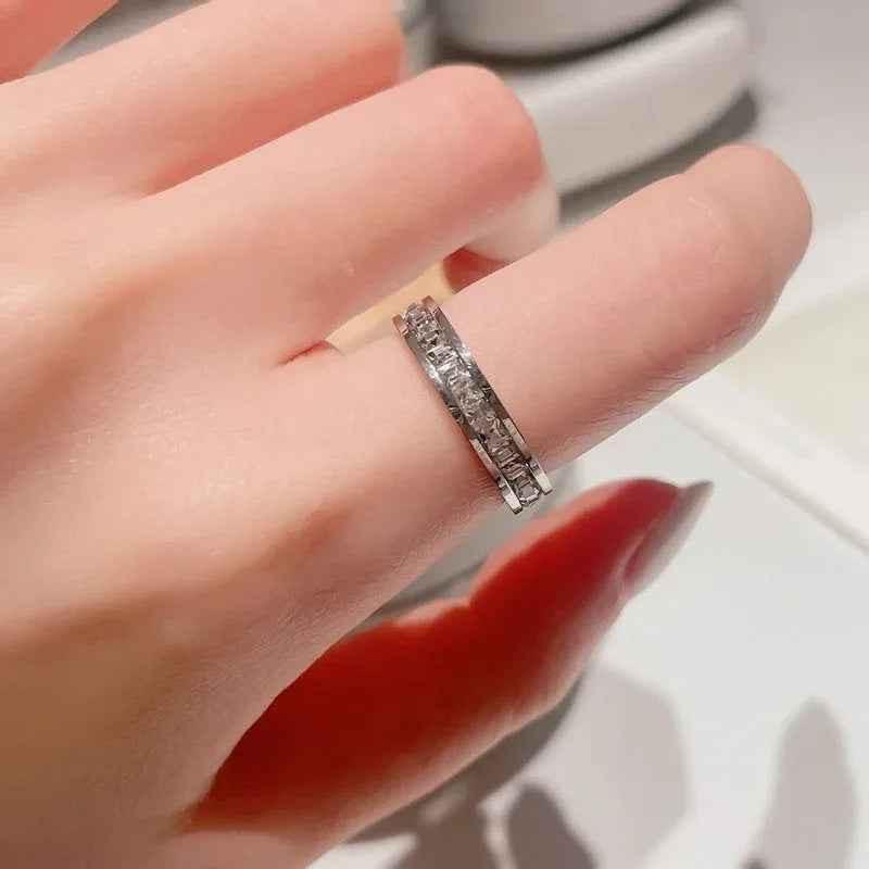 Silver stainless steel square CZ paved band ring by Glitters, showcasing a sleek, modern design with sparkling cubic zirconia accents.