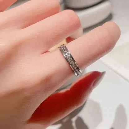 Silver stainless steel square CZ paved band ring by Glitters, showcasing a sleek, modern design with sparkling cubic zirconia accents.