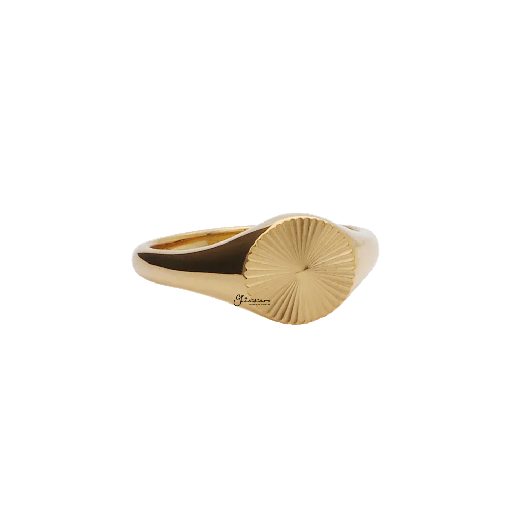 Gold stainless steel sunburst signet ring from Glitters, featuring a bold, engraved sunburst design on a smooth band.