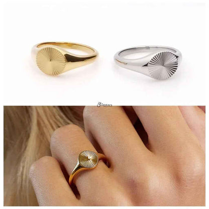 Gold stainless steel sunburst signet ring by Glitters, showcasing a detailed sunburst design on smooth metal surface.