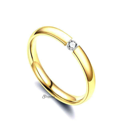 Gold stainless steel tension set ring with 3mm wide glossy mirror-polished band and CZ stones, by Glitters.