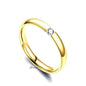 Gold stainless steel tension set ring with 3mm wide glossy mirror-polished band and CZ stones, by Glitters.