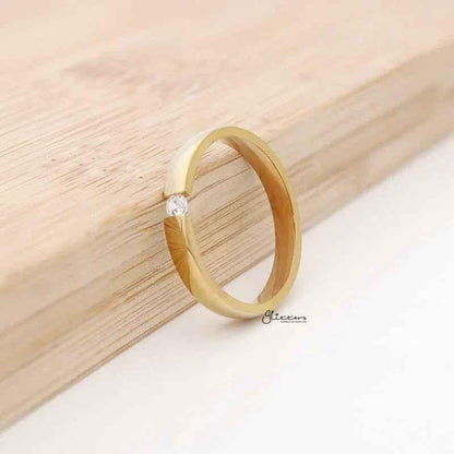Gold stainless steel Tension Set CZ band ring with 3mm width, glossy mirror polish, from Glitters.