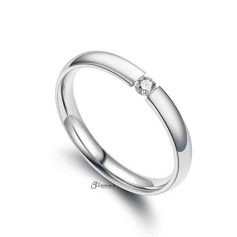 Silver stainless steel tension set ring with 3mm wide glossy mirror polished band and cubic zirconia accents by Glitters
