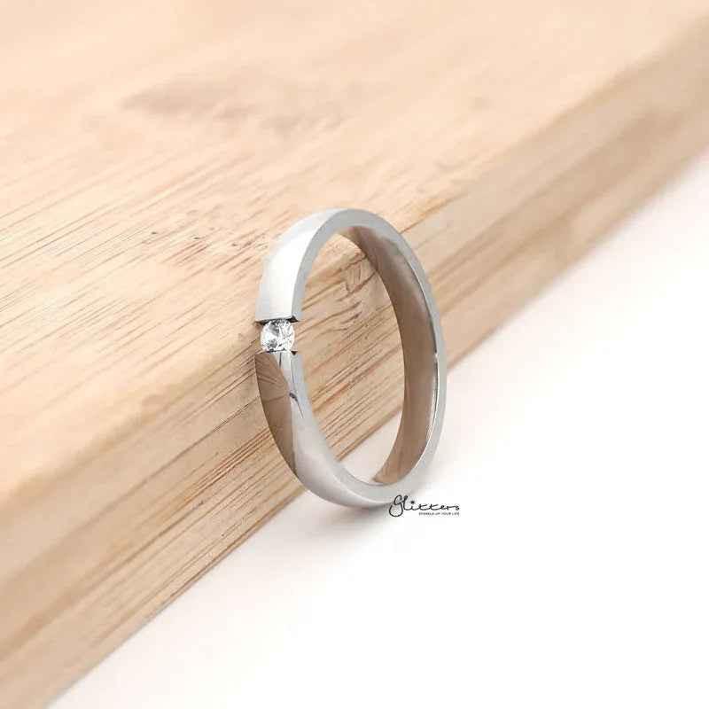 Stainless steel Glitters tension set CZ band ring with 3mm wide glossy mirror-polished silver finish, showcasing its sleek design.