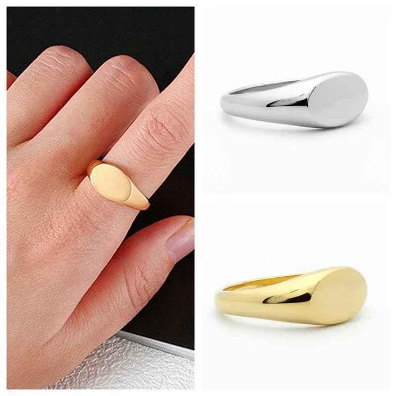 Gold stainless steel oval signet ring from Glitters, featuring a polished smooth surface and classic oval shape.