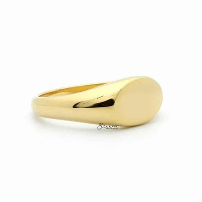 Gold stainless steel oval signet ring from Glitters, featuring a smooth, polished surface and classic signet design.