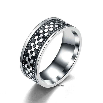 Stainless steel checkerboard band ring by Glitters, featuring a sleek, polished finish and geometric checkerboard pattern.