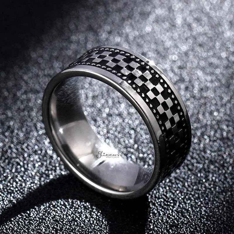 Stainless steel checkerboard band ring by Glitters featuring a polished, geometric checkered pattern on a sleek, modern ring design.