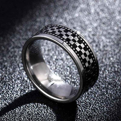 Stainless steel checkerboard band ring by Glitters featuring a polished, geometric checkered pattern on a sleek, modern ring design.
