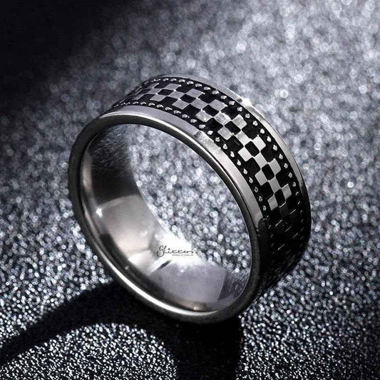 Stainless steel checkerboard band ring by Glitters featuring a polished, geometric checkered pattern on a sleek, modern ring design.