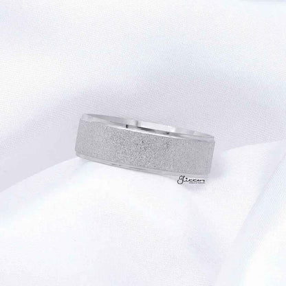 Stainless steel band ring with sandblasted finish, 8mm width, silver color, by Glitters, showcasing its textured surface and sleek design.