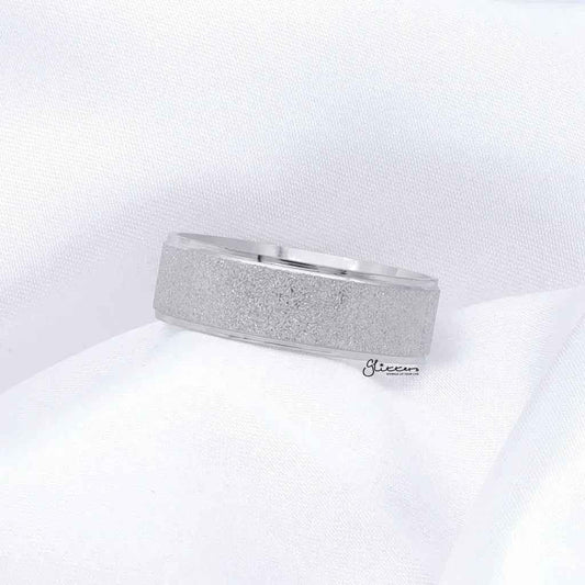 Stainless steel band ring with sandblasted finish, 8mm width, silver color, by Glitters, showcasing its textured surface and sleek design.