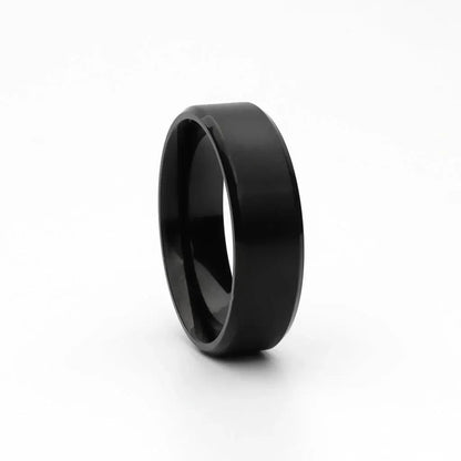 Black titanium-ion plated stainless steel 8mm wide beveled edge band ring from Glitters, showcasing a sleek, polished design.